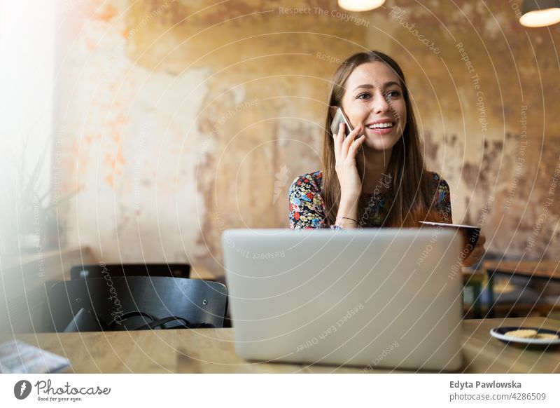 Woman with laptop in cafe people woman young adult casual attractive female smiling happy Caucasian toothy enjoying one person beautiful portrait positivity