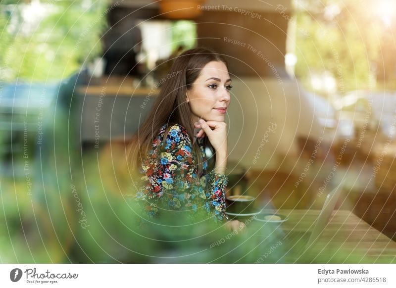 Woman with laptop in cafe people woman young adult casual attractive female smiling happy Caucasian toothy enjoying one person beautiful portrait positivity