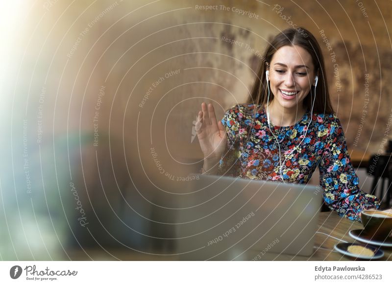 Woman with laptop in cafe people woman young adult casual attractive female smiling happy Caucasian toothy enjoying one person beautiful portrait positivity