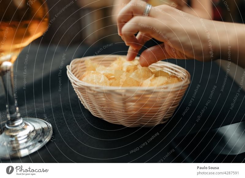 Close up hand picking chips Potatoes Beer Food Appetite Appetizer delicious Plate Lunch snack Delicious Nutrition Meal Tapas Spain spanish Snack food appetizer