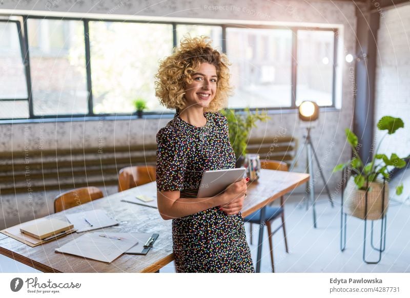 Portrait of confident creative woman in her office business businesspeople businessperson businesswoman caucasian female indoors informal casual young adult