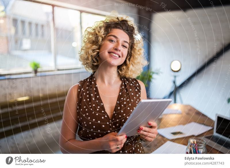 Portrait of confident creative woman in her office business businesspeople businessperson businesswoman caucasian female indoors informal casual young adult