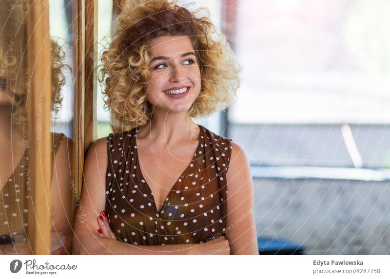 Portrait of confident creative woman in her office business businesspeople businessperson businesswoman caucasian female indoors informal casual young adult