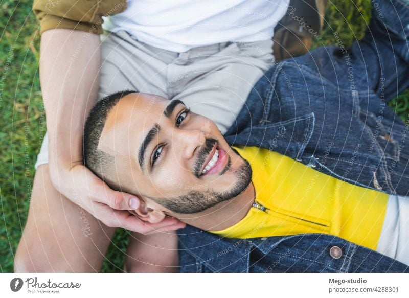 Gay couple spending time together at the park. gay love relationship resting date lovely partnership positive relax freedom life young pride nature dating