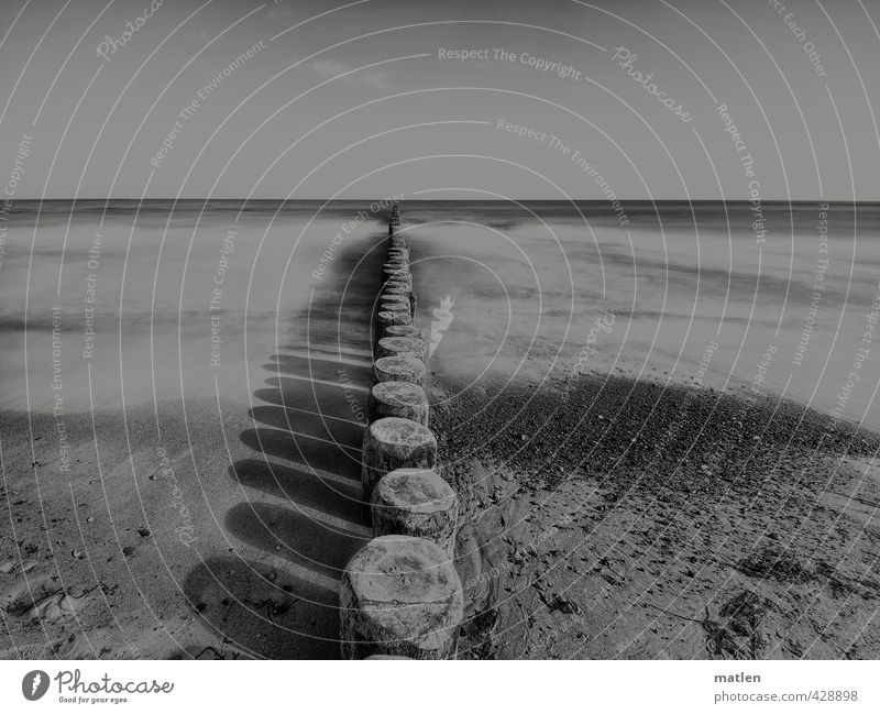 colourless Landscape Sand Water Sky Cloudless sky Horizon Weather Beautiful weather Waves Coast Beach Baltic Sea Black White groynes Shadow play Long exposure