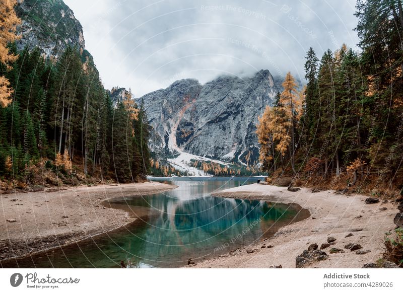 Autumn views of lake lago di braies in dolomites water autumn travel forest landscape nature beautiful scenic tourism dolomiti alpine scenery fall italy