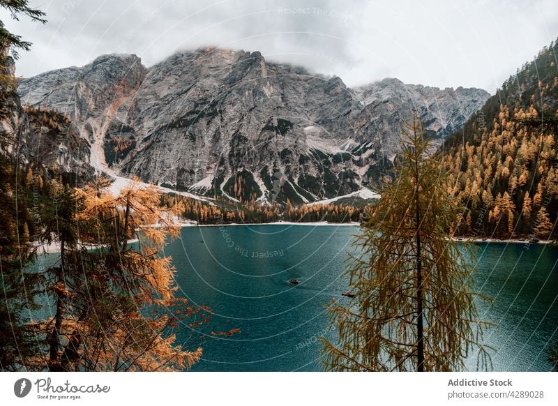 Autumn views of lake lago di braies in dolomites water autumn travel forest landscape nature beautiful scenic tourism dolomiti alpine scenery fall italy