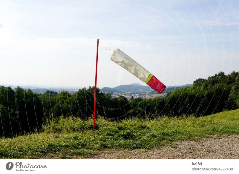 Windsock in white red hardly moves in the wind Wind direction Clouds Sky Flying Weather Pole Wind speed open hose Inflated updraft Luff Aerobatics Gliding