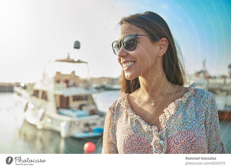 Beautiful young woman in luxury yacht bay, ready to sail. Summer concept. girl vacation summer beauty traveler pretty relax thinking model trip lifestyle