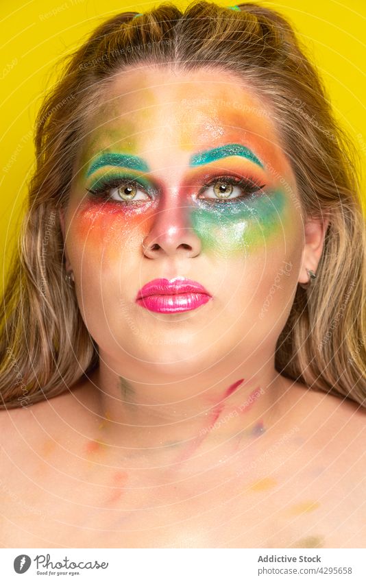 Plump woman with creative makeup colorful model bright appearance portrait human face plump plus size vivid vibrant overweight fashion chubby multicolored