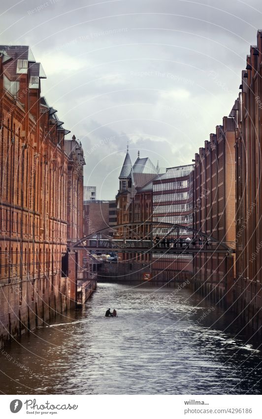 The Speicherstadt in Hamburg storehouse city River Old warehouse district Historic cultural heritage Tourist Attraction Landmark Elbe Bridge Warehouse Complex