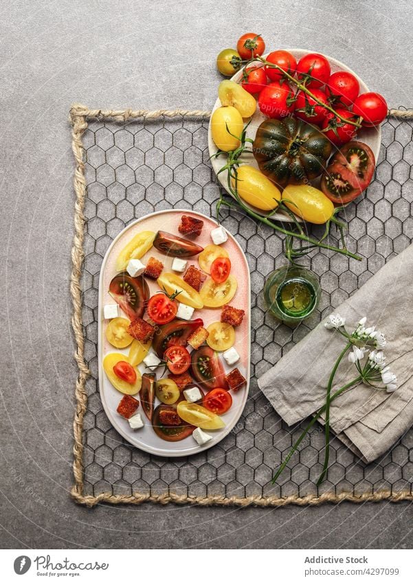 Healthy tomato salad with feta cheese plate ingredient serve lunch healthy food vegetable meal dish vegetarian nutrition fresh cuisine organic diet culinary