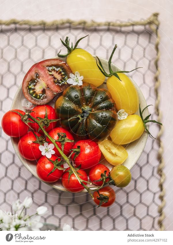 Healthy tomato salad on gray concrete table plate ingredient serve lunch healthy food vegetable meal dish vegetarian nutrition fresh cuisine organic diet