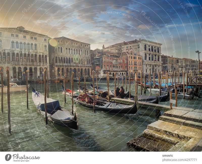 Beautiful sunrise in Venice, views of one of its famous canals crisscrossed by gondolas. venice italy travel architecture venetian italian city water europe