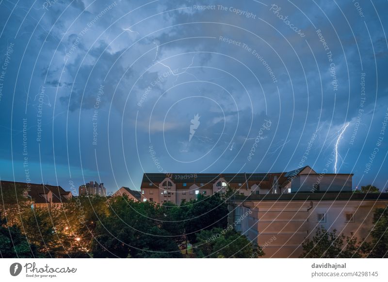 Thunderstorm over the city Mannheim. thunderstorm lightning strike impact electricity hazard danger cloud wind twilight landscape cityscape skyline building