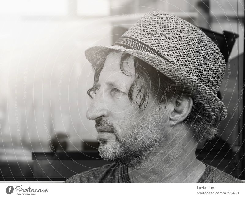 Man with straw hat looks into the distance, is on a journey portrait Summer sunshine Straw hat voyage travel ship Vacation & Travel Exterior shot Sunlight