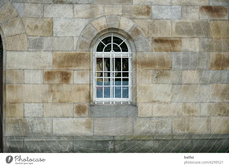 Wall with blocks of sand-lime brick, perfectly masoned with round arch and latticed window Wall (barrier) Wall (building) Window Facade Building Architecture