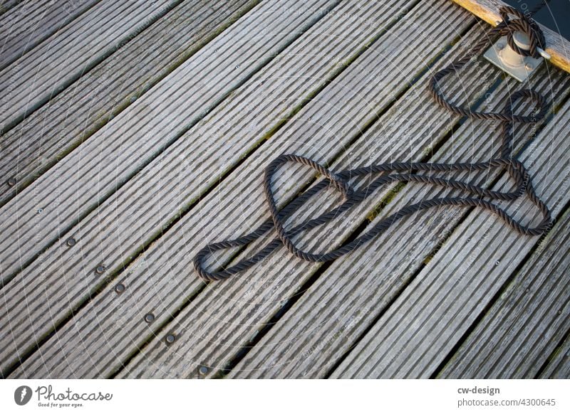 Somewhere on a jetty in Holland Footbridge Sailrope Watercraft sailing ships sailboats Sailing yacht Sailing trip Sailing vacation Sunlight Relaxation