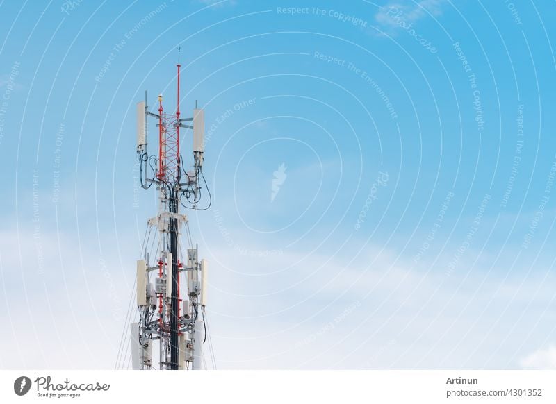 Telecommunication tower with blue sky and white clouds background. Antenna on blue sky. Radio and satellite pole. Communication technology. Telecommunication industry. Mobile or telecom 4g network.