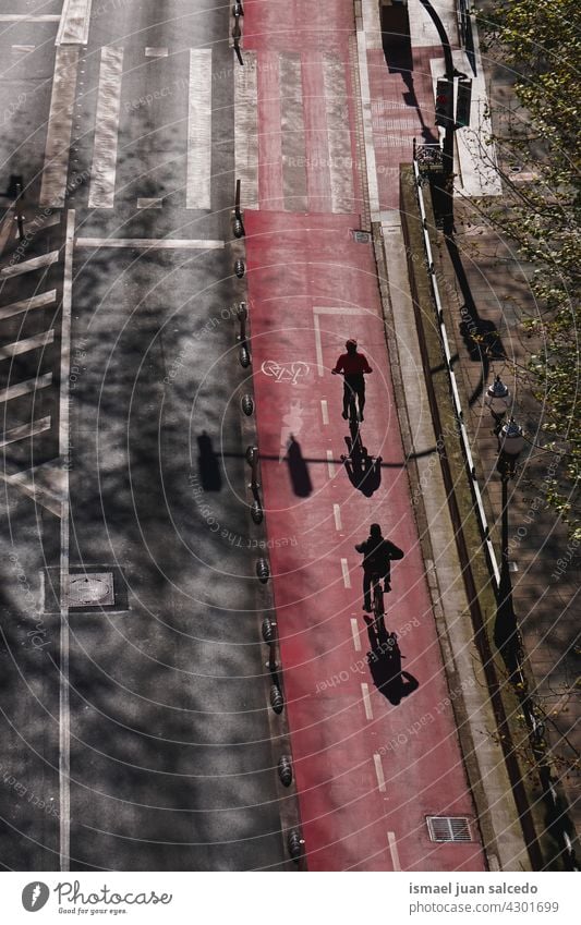 cyclist on the street in Bilbao city spain biker bicycle transportation cycling biking exercise ride speed fast motion movement road urban outdoors people