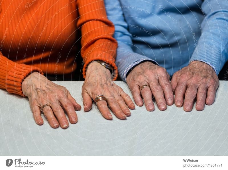 Two pairs of old hands that belong together as the wedding rings prove Couple Matrimony Married couple Old man and woman married couple Wedding rings older