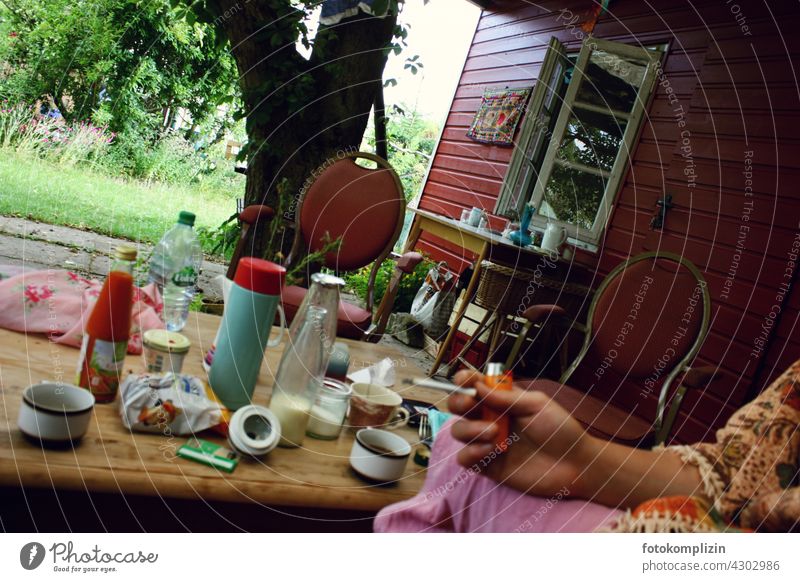 Garden cottage atmosphere Smoking Gardenhouse Garden plot Garden allotments tepid still life Table Swedish house Private sphere Swedish red Garden Life chairs