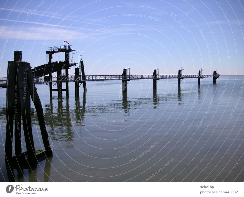 Pier at the harbour in Borkum Ocean Jetty Clouds East frisian island Water reflection Harbour North Sea Graffiti