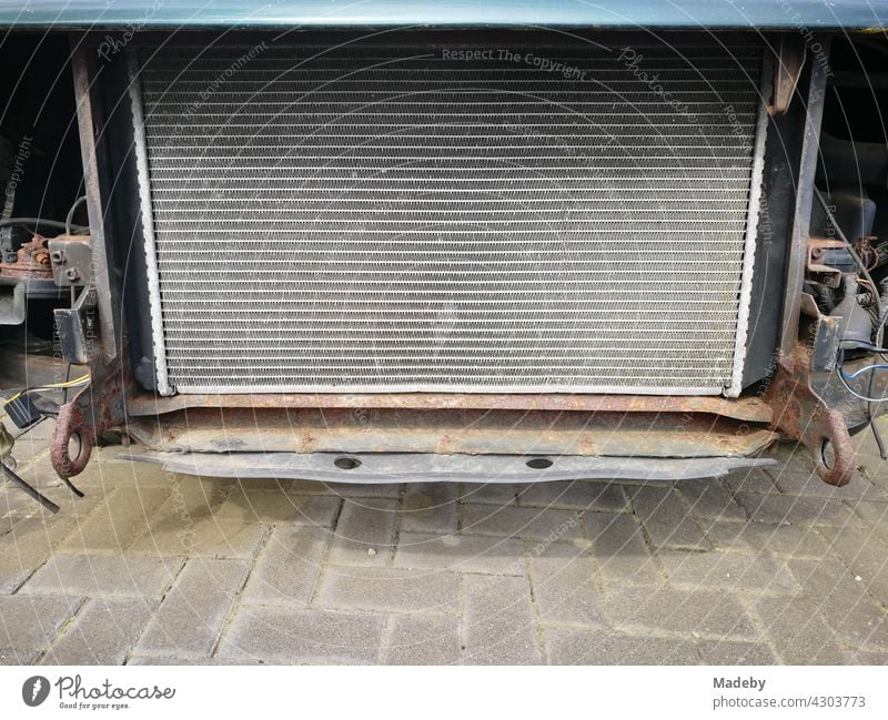 Water radiator of a Swedish sedan of the eighties in a workshop in Lage near Detmold in East Westphalia-Lippe car cooler Honeycomb Water cooler technique