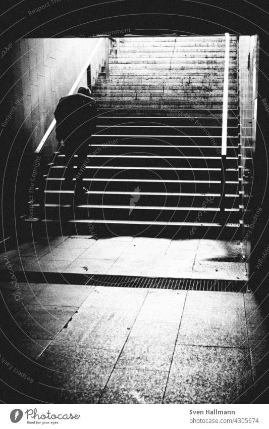 Man walking down a staircase between two imposing buildings Architecture Building Modern architecture Facade Esthetic Symmetry Design Abstract Arrangement Line