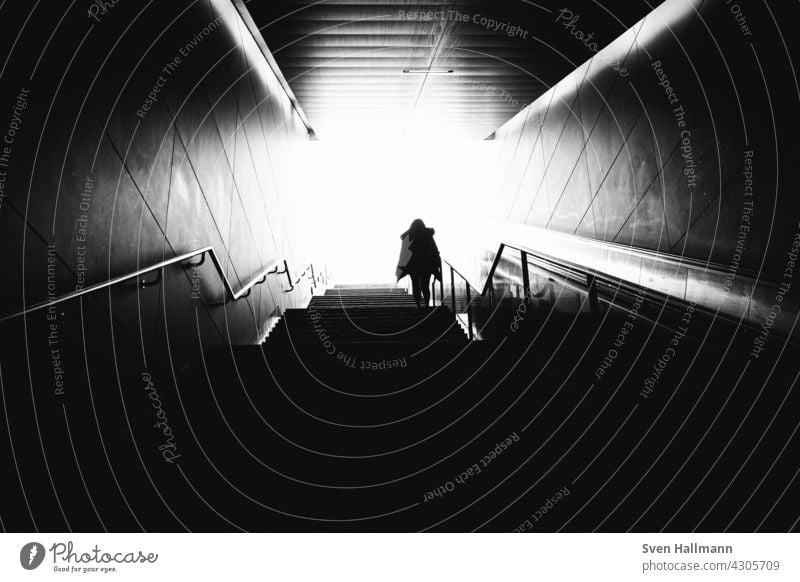 Man walking down a staircase between two imposing buildings Architecture Building Modern architecture Facade Esthetic Symmetry Design Abstract Arrangement Line