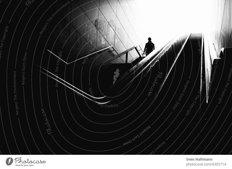 Man walking down a staircase between two imposing buildings Architecture Building Modern architecture Facade Esthetic Symmetry Design Abstract Arrangement Line