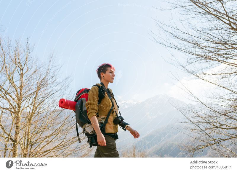 Thoughtful traveling woman in highlands traveler mountain admire observe adventure female backpack journey trip walk freedom wanderlust rock carefree