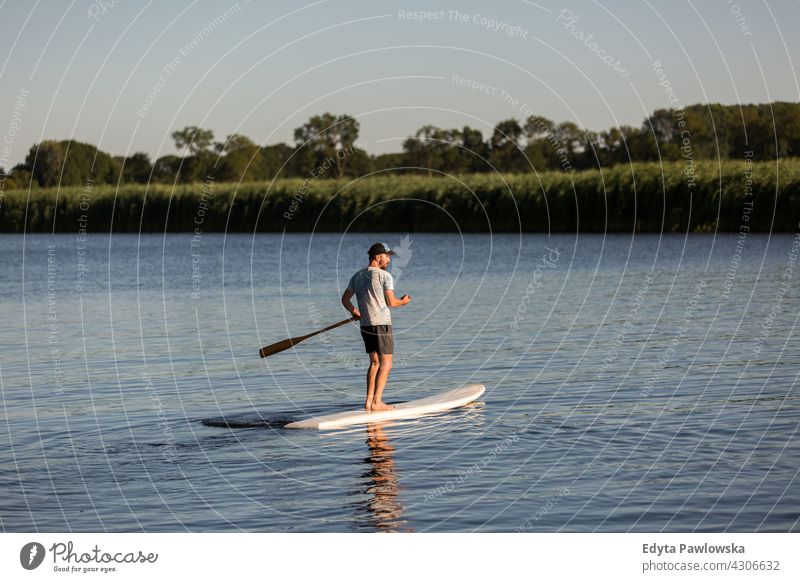 Man on a Paddle Board, Holland canal Netherland Active Adult Balance Boarding Body Calm Enjoyment Exercise Fit Fitness Fun Healthy Hobby Lake Leisure Lifestyle