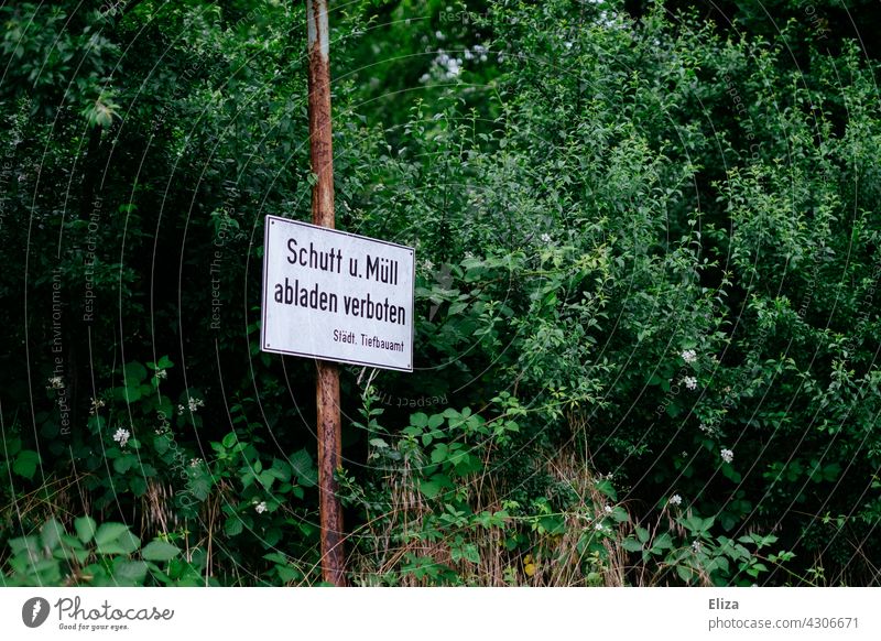 Sign in the nature on the "Debris & garbage dumping prohibited" - concept environmental pollution Environmental pollution Trash sign forbidden dump rubbish