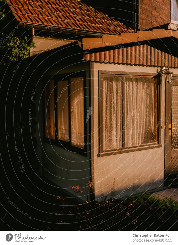 Sunlight on a house at dusk at a cool clear lake in the hot summer in Mecklenburg-Western Pomerania Nature Shadow Visual spectacle Deserted silent melancholy