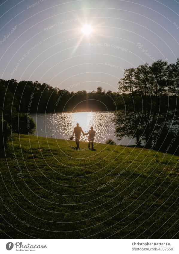 Hand in hand at a cool clear lake in the hot summer in Mecklenburg-Vorpommern Nature Shadow Visual spectacle Deserted silent melancholy Loneliness romantic