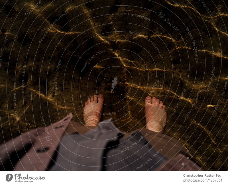 With both feet in a cool clear lake in the hot summer in Mecklenburg-Vorpommern Nature Shadow Visual spectacle Deserted silent melancholy Loneliness romantic