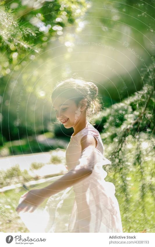 Delighted ballerina playing in summer park girl playful teenage ballet dancer happy meadow dress joy nature cheerful freedom carefree harmony charming enjoy