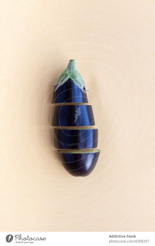 Fresh cut eggplant on beige table piece aubergine fresh vegetable ripe healthy food natural organic vitamin raw product yummy delicious ingredient tasty