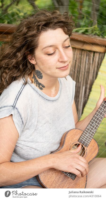 young woman playing ukulele Ukulele Woman Musician Relaxation Lifestyle tool Artist Playing Vacation & Travel Style naturally romantic Nature Entertainment