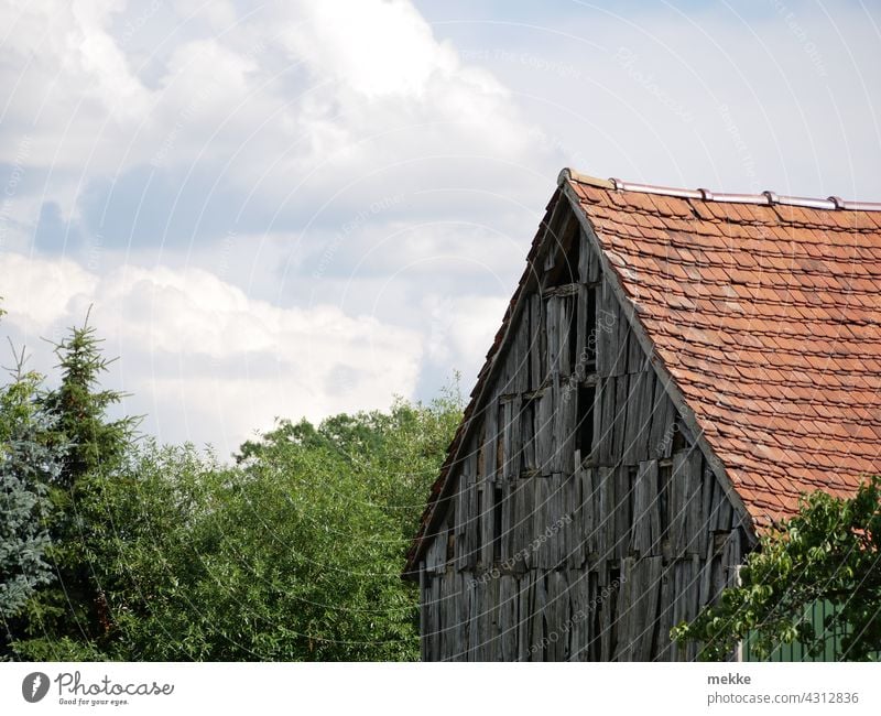 Old rustic wooden facade of a barn in a small village Facade Barn disintegrate Rustic House (Residential Structure) Wood Rural Wall (building) Village Farm