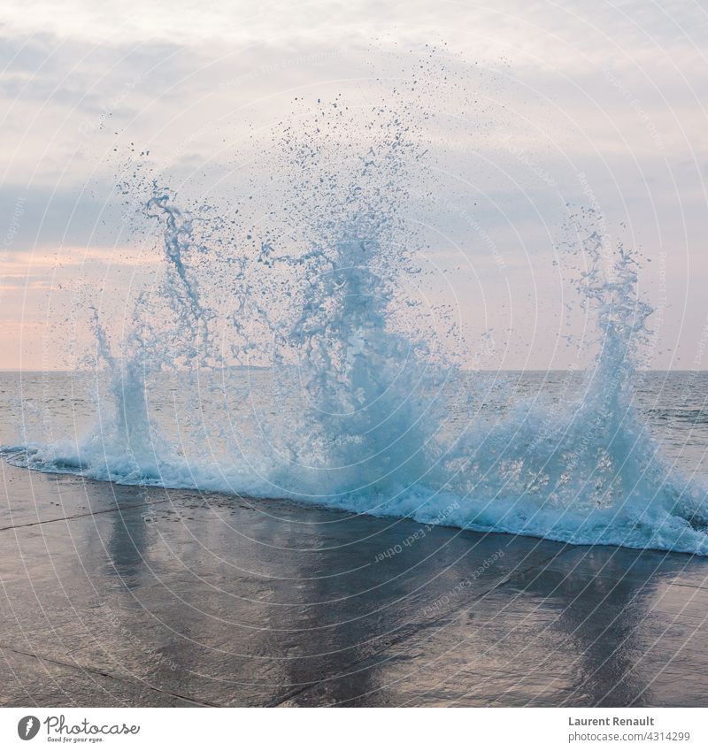 Splashing wave in Saint-Malo brittany dike dyke flood flooding foam nature sea splash splashing spray storm strong tide water weather wind