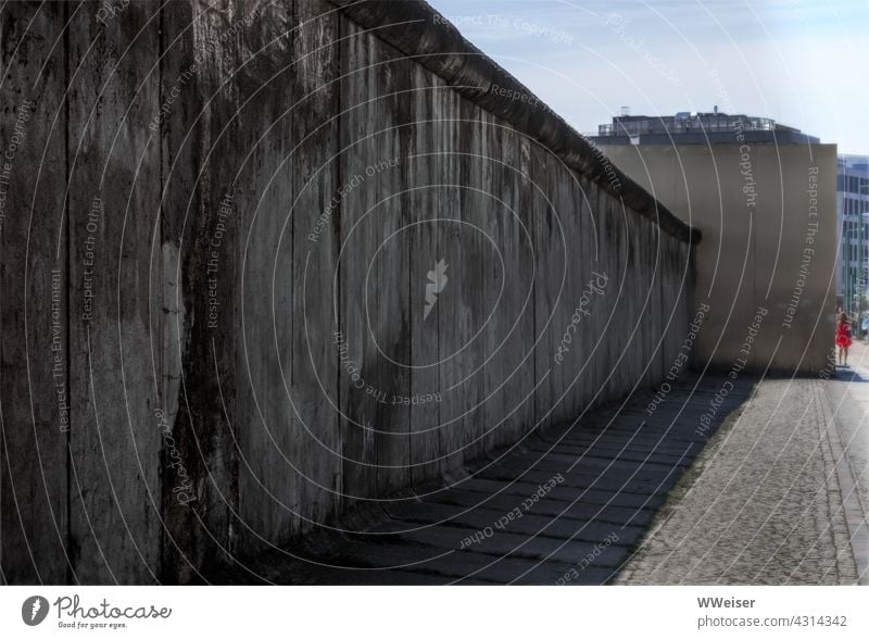 At this point the Berlin Wall still seems like insurmountable, gloomy reality Wall (barrier) History of the Germany GDR memorial Monument somber Divided