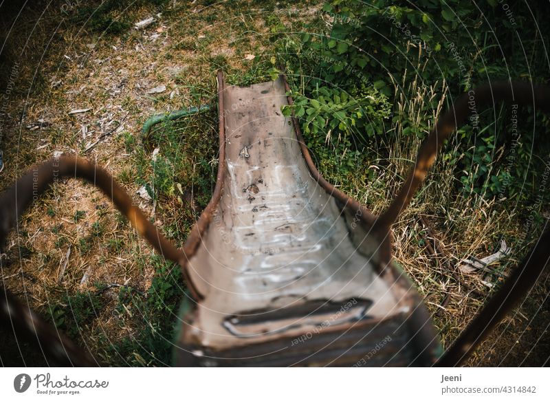 Lost Land Love | Rusty Slide in the Abandoned Land Playground Playground equipment Skid Past past times Transience transient Detail detail Former lost places