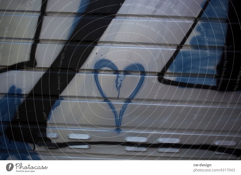 A blue heart Copy Space middle Copy Space bottom Copy Space top Copy Space right Copy Space left Exterior shot Subdued colour Colour photo Kitsch Longing