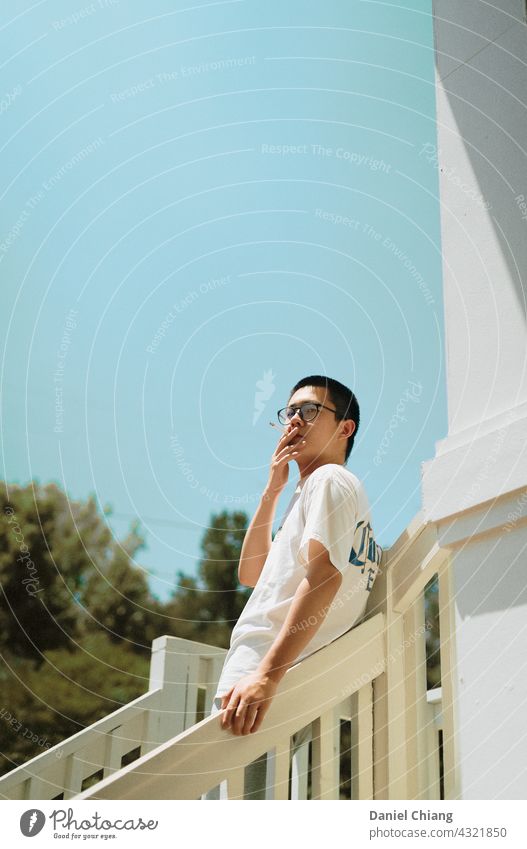 Guy Smoking Smoke Cigarette smoke Man guy mood mad moody moment Lifestyle Face asian Smoky young teen boy standing angry Exterior shot outside Stairs