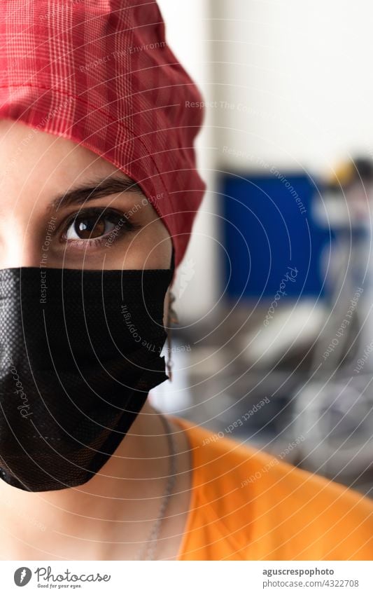 Face of a young doctor prepared to enter the operating room eye face portrait nurse mask surgical mask cap surgical cap pupil hospital operation room uniform