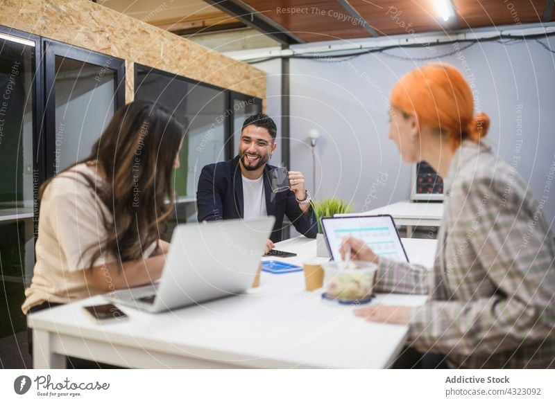 Busy coworkers working together at table startup space colleague business meeting project teamwork group office collaborate workplace professional cooperate