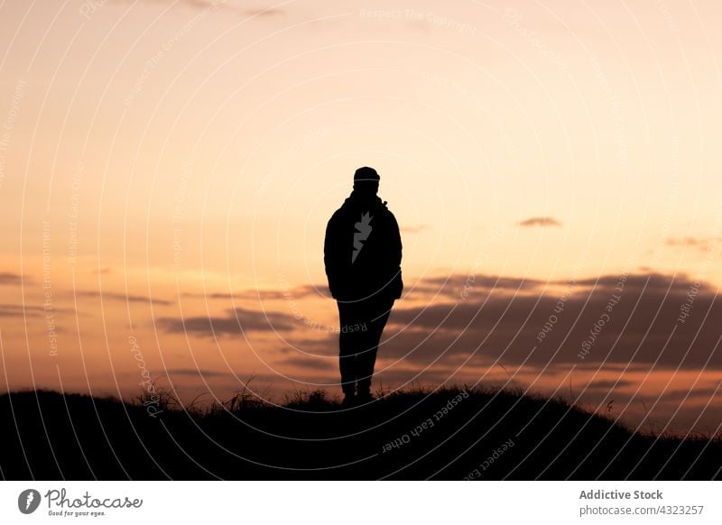 Silhouette of a man from behind looking at the sunset silhouette nature sky person travel people landscape sunrise outdoor beautiful summer young orange freedom