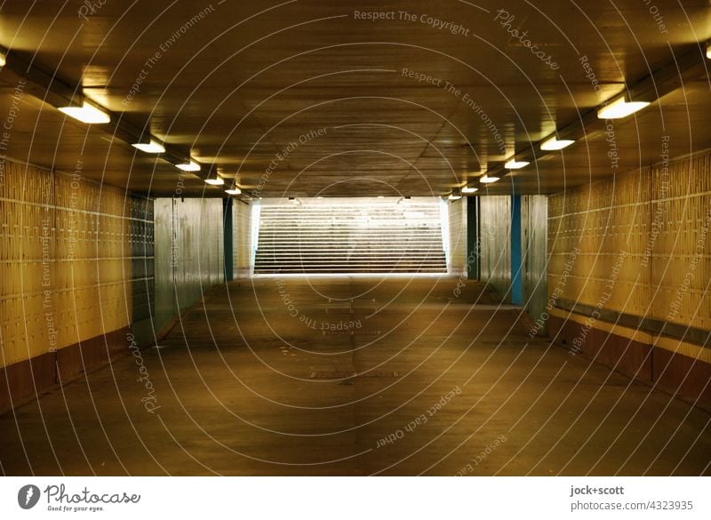 straight undercrossing with artificial lighting Tunnel Tunnel vision Subsoil Marzahn Berlin Architecture Light (Natural Phenomenon) Structures and shapes